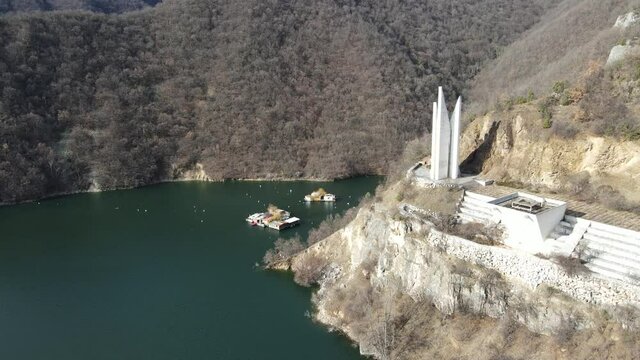 Aerial view of Memorial of Rhodope partisan detachment Anton Ivanov at the coast of The Vacha Reservoir,  Bulgaria