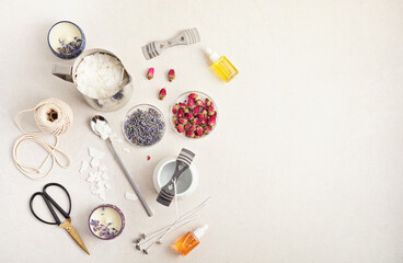 Ingredients and tools for handmade aroma candles. Organic soy wax, essential oils, wicks, pots
