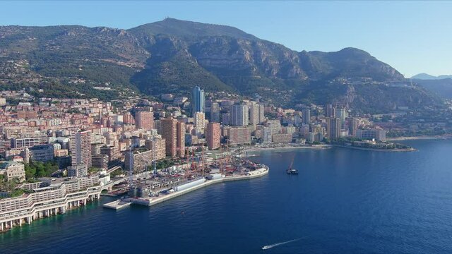 Monte Carlo, Monaco. Aerial view of famous city towering over Mediterranean Sea, modern high-rise buildings, Les Plages beaches  - landscape panorama of Europe from above