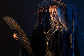 An Asian-style character in a kimono and a straw hat with ribbons