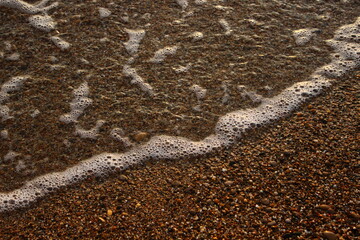 Fototapeta na wymiar wave on the sand 