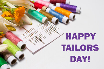 Greeting card with multi-colored threads and the text Happy Tailors Day. For the holiday of a seamstress, tailor, atelier worker