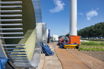 Dutch construction site windturbine farm with wings ready to install