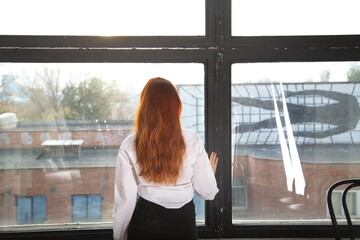 woman looking at the window lifestyle portrait