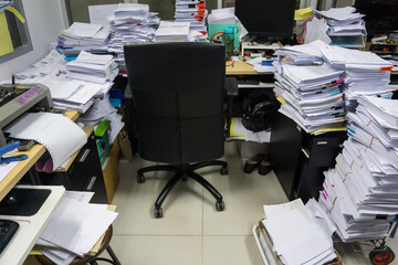 Busy, messy and cluttered workplace, full of documents