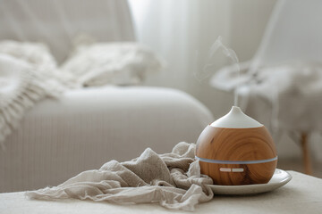 Cozy composition with aroma diffuser for air humidification.