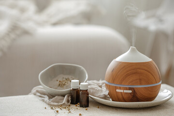 Spa composition with air humidifier and essential oils.