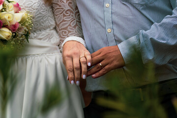 bride and groom holding hands