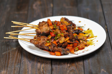 Sate Kambing or satai goat is a food made from young goat meat which is stabbed with a stick and then burned using wood charcoal.