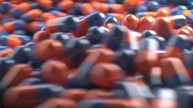 Animation von Blauen und Orangenen Pillen die sich im Strudel bewegen