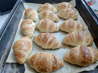 Freshly baked homemade french croissants on plate