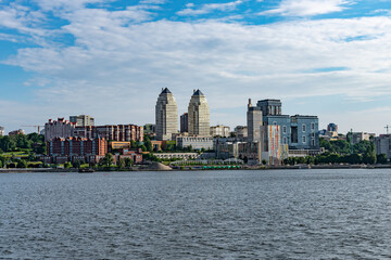 Obraz premium Construction of high-rise buildings in the city of Dnipro. View from the river.