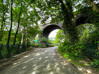 Fototapeta na wymiar Victorian stone viaduct, crossing over the River Aire, off, Dockfield Road, Shipley, Bradford, UK