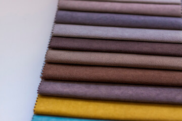 Backgrounds made of natural and artificial fabrics for the decoration of textiles, furniture and clothing on a beige background. Furniture production. wallpaper with space for copying text.