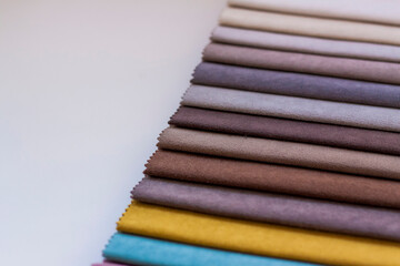 Obraz premium Backgrounds made of natural and artificial fabrics for the decoration of textiles, furniture and clothing on a beige background. Furniture production. wallpaper with space for copying text.
