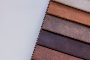 Backgrounds made of natural and artificial fabrics for the decoration of textiles, furniture and clothing on a beige background. Furniture production. wallpaper with space for copying text.