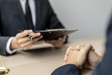 Client was listening to a lawyer advising on an embezzlement case, explaining the details of the...