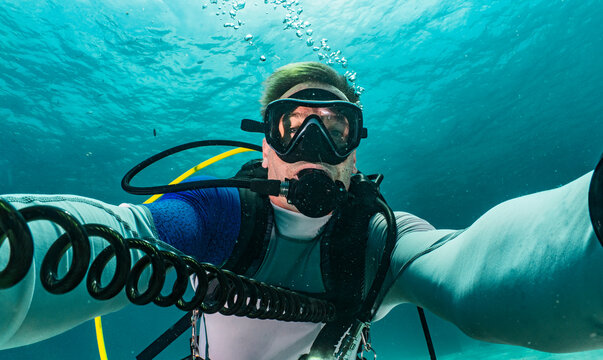 diver taking selfie in the tropical waters around Phuket