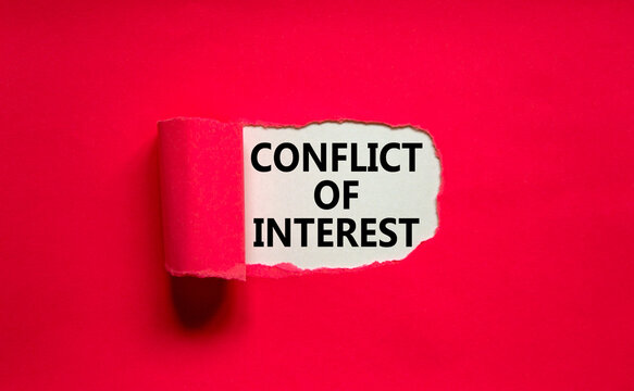 Conflict of interest symbol. Words 'Conflict of interest' appearing behind torn purple paper. Beautiful purple background. Business, conflict of interest concept, copy space.