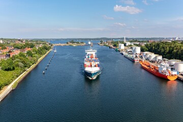 ships in the Kiel canal with Holtenau Locks in the background