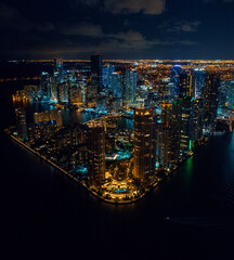 downtown miami brickell key city skyline at night from a drone