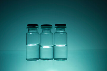 glass bottles with transparent medicine. Cure for the virus, 