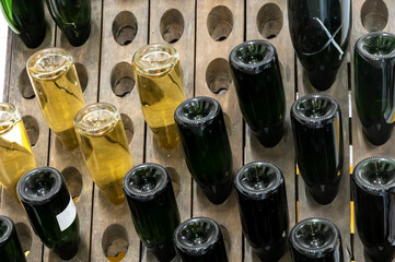 Traditional champagne sparkling wine making process in caves near Epernay, Champagne region, France