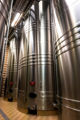 Traditional champagne sparkling wine making process in steel tanks in caves near Epernay, Champagne region, France