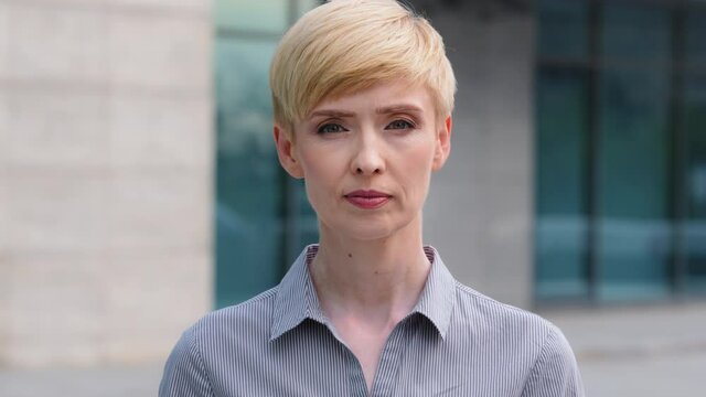 Portrait Caucasian Mature Woman With Short Hair Middle Age 40s Businesswoman Lady Standing Posing Outdoors On Street Looking At Camera Shaking Head Negatively Answering No Disagree Denial Prohibition