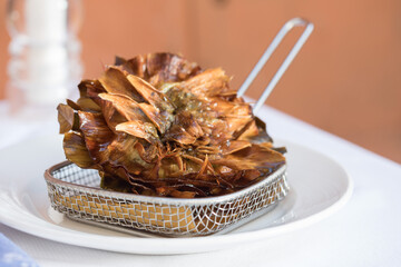 carciofi alla giudia on a plate