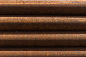 The texture of the surface of rusty metal pipes, background.