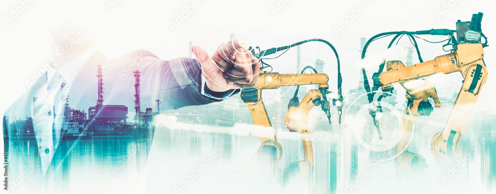 Poster mechanized industry robot arm and factory worker double exposure . concept of robotics technology fo