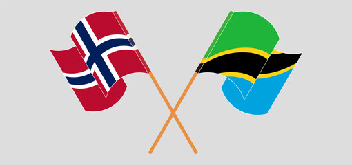 Crossed and waving flags of Norway and Tanzania