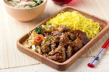 meat with teriyaki sauce and noodles