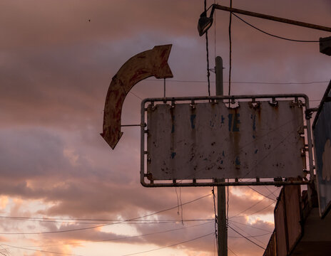 Old sign in sunset