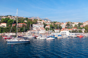 Fototapeta na wymiar Coastal town Herceg Novi in Montenegro . Yachts and Boats in Kotor Bay harbor 