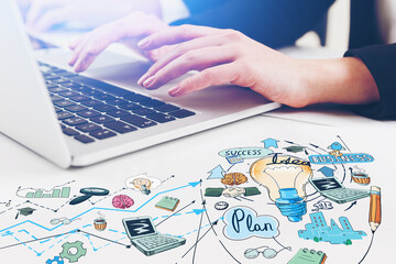 Woman hands typing on laptop. Research process of new idea for start up. Colorful light bulb...