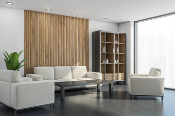 Cupboard and light beige furnishings in the white living room corner