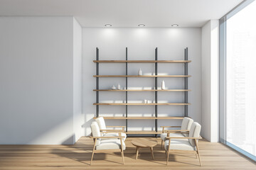 White waiting room with shelvig unit, four armchairs and panoramic view