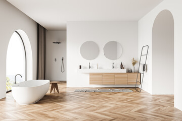 Luxury white bathroom with arches and wood alike floor
