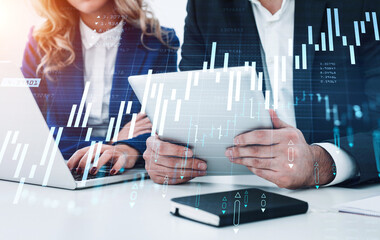 Businessman and businesswoman traders working together to develop new trading strategy. Stock market changes, business graph chart. Overlay. Concept of internet trading