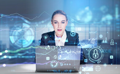 Front view of concentrated attractive businesswoman with laptop,