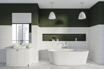 Bathtub and vanity in the industrial white bathroom with dark green details