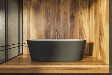 Cabin bathroom with oval black tub and wood alike material