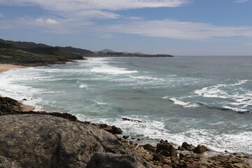 Image of the beach with waves and rocks of the castros de Baroña. Porto do Son. Galicia. Spain.
