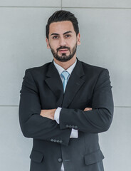 business man wearing a suit to work, office worker looks friendly