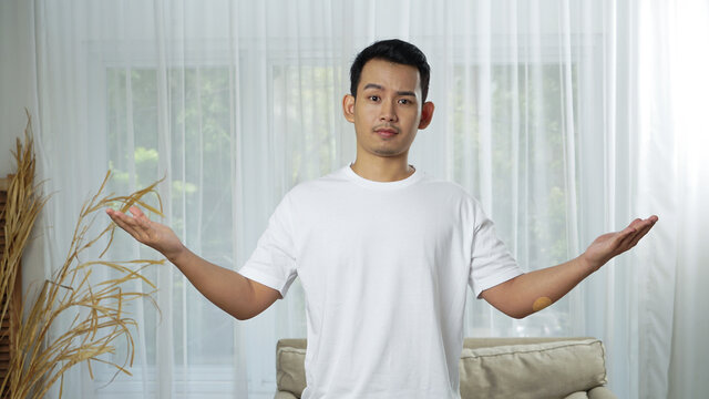 Asian man look confuse