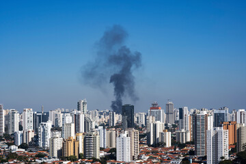 Black smoke in a city. Sao Paulo Brazil. 