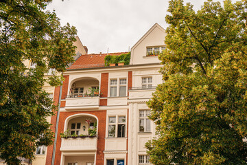 house with big balcony and tree