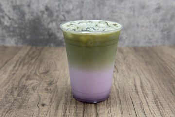 Matcha taro milk tea cold beverage mixes iced boba drink for a refreshing beverage - obrazy, fototapety, plakaty